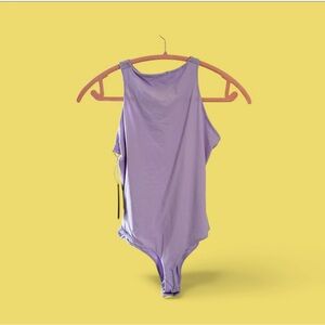 SKIMS body suit fit everybody. NWT